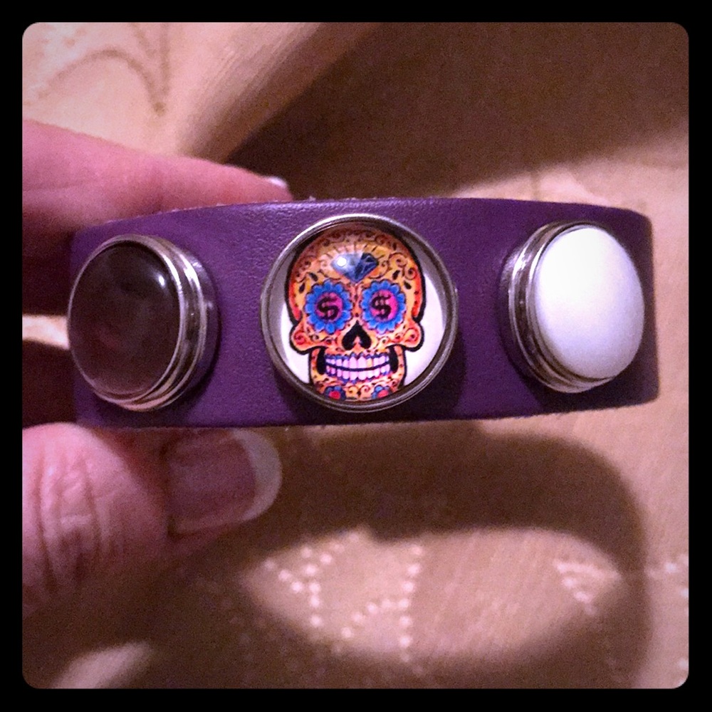 Purple leather snap bracelet with skull snap